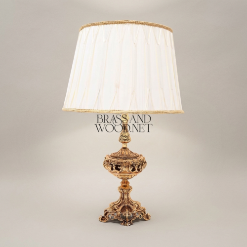 Baroque Heavily Ornate Repoussé Brass Table Lamp Pleated Cream Fabric Shade Brass and Wood Antique Gold Detail | Brass & Wood