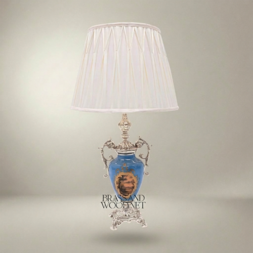 Classical Blue Porcelain Urn Table Lamp with Ornate Brass Scrollwork Handles and Hand-Painted Landscape Medallion White Pleated Shade Brass and Wood Silver Front | Brass & Wood