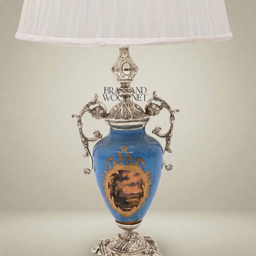 Classical Blue Porcelain Urn Table Lamp with Ornate Brass Scrollwork Handles and Hand-Painted Landscape Medallion White Pleated Shade Brass and Wood Silver Front | Brass & Wood