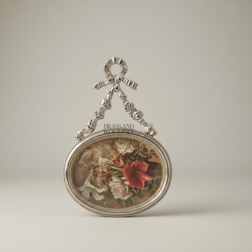 Louis XVI Oval Brass Picture Frame with Bow & Floral Garland Crest - Silver