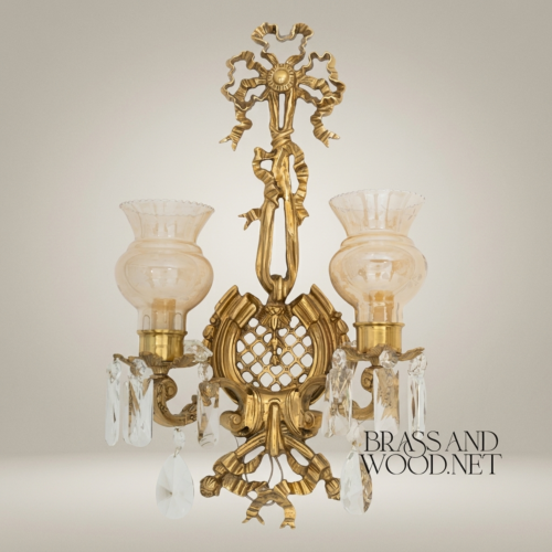 أبليك حائطي كلاسيكي بذراعين نحاسيين - زخرفة الشرائط والشراشيب مع قطرات الكريستال - Antique Gold