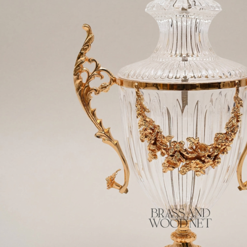 Neoclassical Lidded Crystal Urn Vase with Brass Floral Swag Handles and Ornate Pedestal Base - Brass & Wood Gold Front | Brass & Wood
